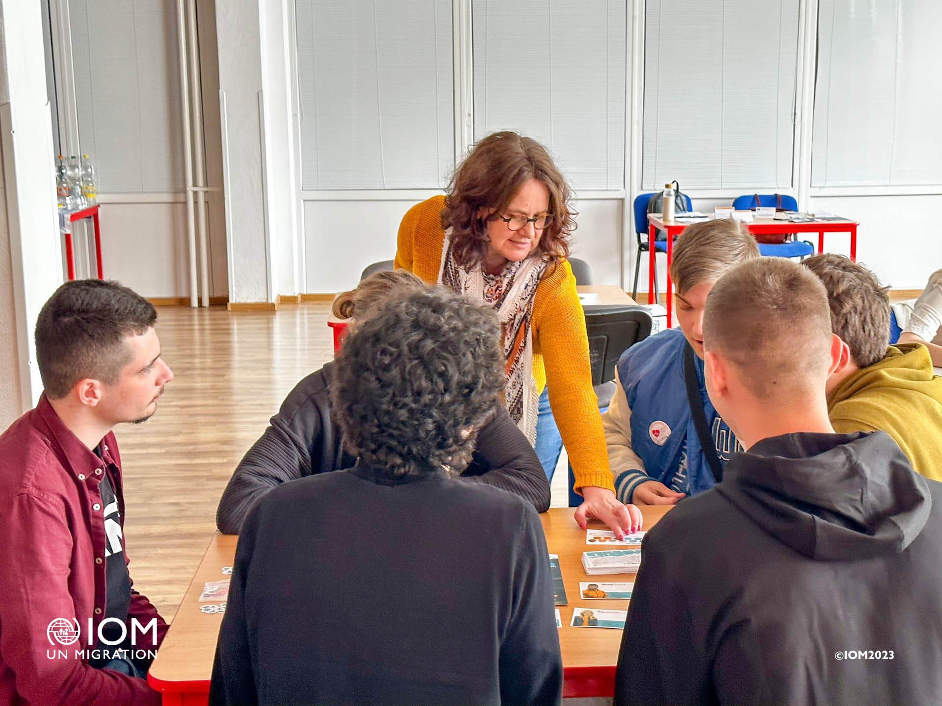 Photo - Students are discussing migration policies as part of the educational activity Destination Europe. © International Organization for Migration (IOM) 2023.